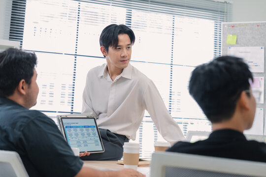 Business leader facilitates strategic hackathon utilizing AI-powered analytics and cross-functional collaboration to drive digital transformation through agile methodologies and data-driven innovation