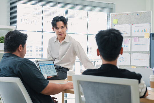 Business leader facilitates strategic hackathon utilizing AI-powered analytics and cross-functional collaboration to drive digital transformation through agile methodologies and data-driven innovation