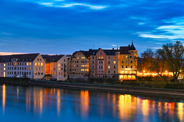 Fototapeta premium Beautiful old buildings and Danube river at night in Regensburg, Germany