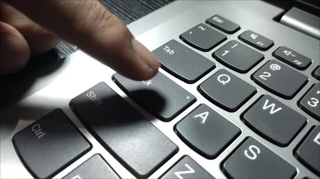 Press the caps lock button on the keyboard using one finger, namely the index finger