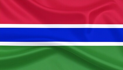 Red for the sunlit savanna, blue for the river’s eternal flow, green for the fertile land—and white for peace between them all. The Gambia’s flag stretches in harmony, a banner of nature and unity, st
