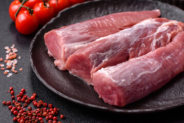 Raw pork tenderloin, fresh meat, a source of protein, and an ingredient for a meal. Pork tenderloin