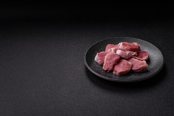 Raw pork tenderloin, sliced, is fresh meat, a source of protein. Pork tenderloin