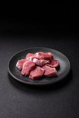 Raw pork tenderloin, sliced, is fresh meat, a source of protein. Pork tenderloin