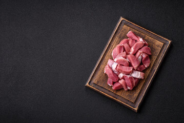 Raw pork, sliced, fresh meat, a source of protein, and an ingredient for a hearty meal. Raw pork