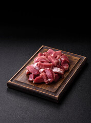 Raw pork, sliced, fresh meat, a source of protein, and an ingredient for a hearty meal. Raw pork