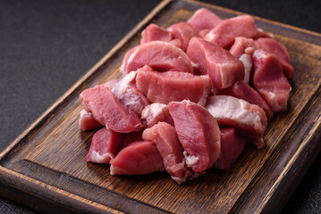 Raw pork, sliced, fresh meat, a source of protein, and an ingredient for a hearty meal. Raw pork