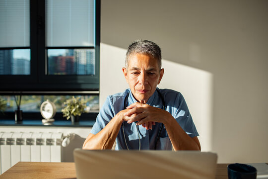 Senior person working on laptop