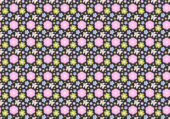 Cute ditsy floral seamless pattern in a cottagecore style. A background with small, colorful meadow flowers on a dark backdrop for kids' fabric or wallpaper.