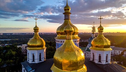 Golden domes of a cathedral at sunset