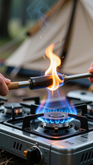 Naklejka premium Igniting a camping stove outdoor adventure cooking gear nature close-up survival skills