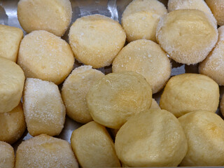 pile of cheese fish balls in a stainless steel tray. 