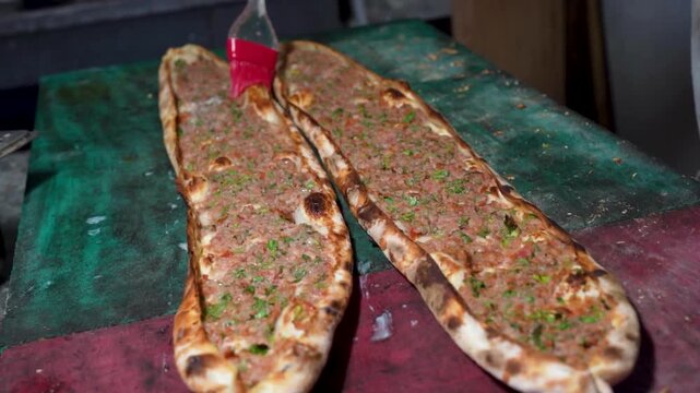 Turkish pide with pieces of meats	