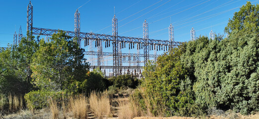 View of a large electrical substation, highlighting the complexity of its cables and structures