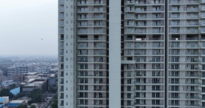 aerial view of modern residential building with green forest, real estate development 4k footage