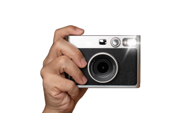 Hand with classic camera and bright flash