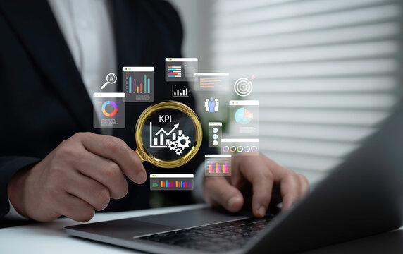 Businessman analyzing KPI with magnifying glass and data charts on laptop, symbolizing performance evaluation, business analytics, corporate strategy, goal measurement and success tracking