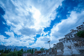 Ladakh,India-May,23,2025: Tibetan prayer stones and view on Thiksay monastery, Ladakh, one of more interesting objects in the Indus valley in Leh District, India