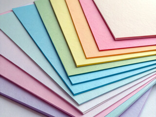 Pastel Colored Paper Stack Fanned Out in Gradient on White Background Ai-Generated