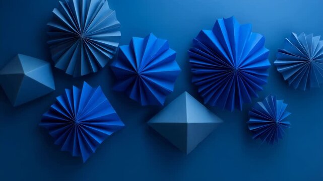 Abstract folded blue paper origami shapes with geometric patterns placed on a dark blue background, concept of creativity and modern art