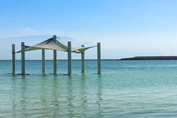 sunshade in the water , relaxing at the Dead Sea