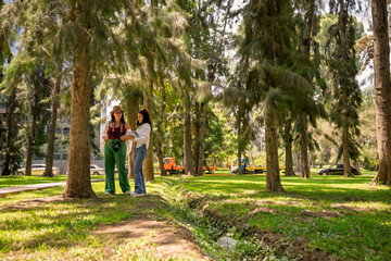 Fototapeta premium Biology students doing fieldwork in urban forest