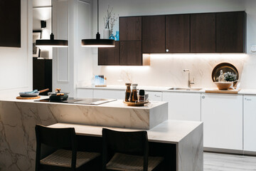 Modern kitchen interior with minimalist design and functional furniture.