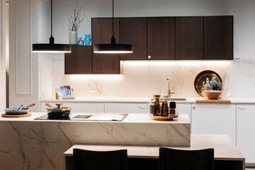Modern kitchen interior with minimalist design and functional furniture.