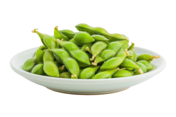 Freshly harvested green edamame served in a white bowl, showcasing their vibrant color and natural texture isolated on transparent background
