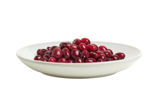 Freshly harvested red beans arranged beautifully on a white plate against a simple background, showcasing their natural sheen isolated on transparent background