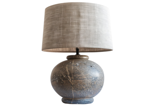 A beautifully crafted stone lamp with a textured fabric shade illuminating a serene interior space with elegance and charm isolated on transparent background