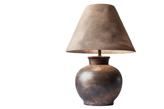 Artisan table lamp with a textured shade and clay base enhancing natural decor in a serene indoor setting isolated on transparent background