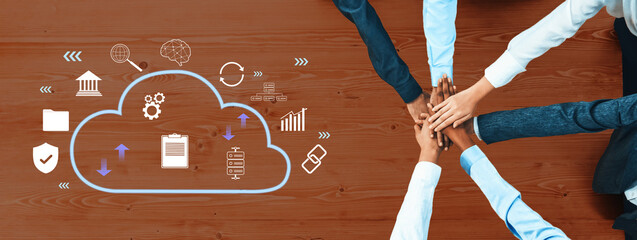 A diverse group of business professionals collaborates around a cloud symbol, highlighting teamwork and digital innovation for successful problem-solving and strategic growth. Trope