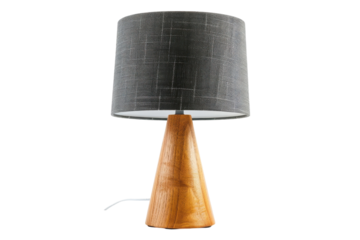 A modern table lamp with a wooden base and textured fabric shade illuminating a minimalist workspace isolated on transparent background