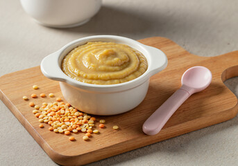 Baby food mashed lentils in bowl