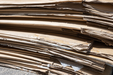 Stack of dirty old paper box on the street.
