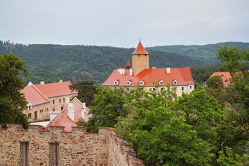 Castle Veveri with forest around, roof wet from rain, typical well preserved medieval Czech architecture