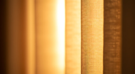 Warm golden light streaming through textured curtains, creating a soft, inviting ambience perfect for home decor or lifestyle projects