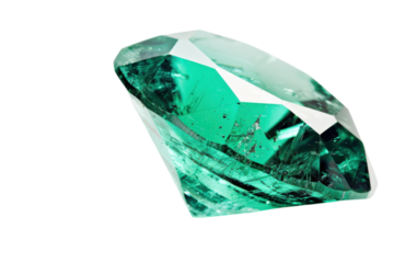 A dazzling emerald cut gem reflects light uniquely on a white surface showcasing its exquisite facets and vivid green hue isolated on transparent background