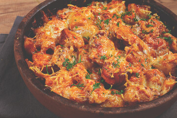 Baked fish with potatoes and cheese, gratin, homemade, no people,