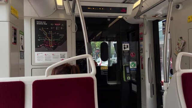 Toronto, Ontario, Canada, June 15, 2025: DOLLY SHOT - Interior view of the TTC Flexity Outlook streetcar. The Flexity Outlook streetcar is made by Bombardier.
