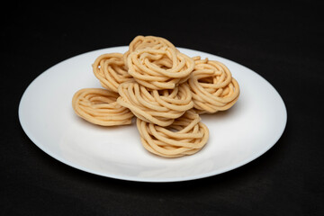 Murukku is a savoury snack popular in south India and Sri Lanka. chakli south indian traditional vegetarian snack