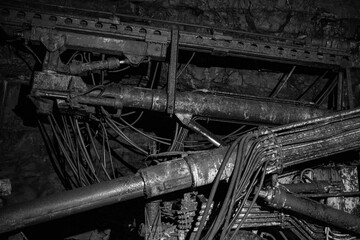Old drilling jumbo in underground mine