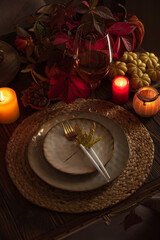 Autumn Table Setting with Pumpkins, Candles and Leaf Decor