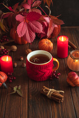 Cozy Autumn Scene with Mulled Wine, Candles, Pumpkins and Seasonal Decor