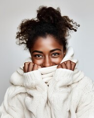 Smiling woman in cozy white sweater