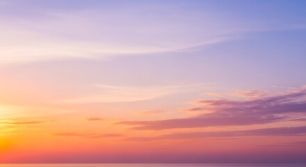 Obraz premium Beautiful sunset sky with orange, pink, and purple hues over the ocean