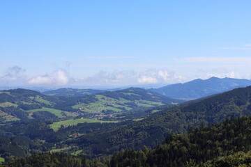 Idyllic panorama of a hilly agricultural landscape, farmland scenery, rural countryside, scenic view