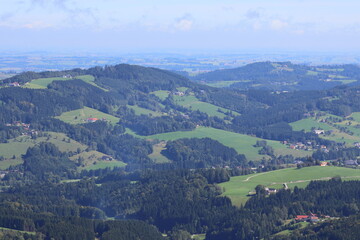 Fototapeta premium Idyllic panorama of a hilly agricultural landscape, farmland scenery, rural countryside, scenic view