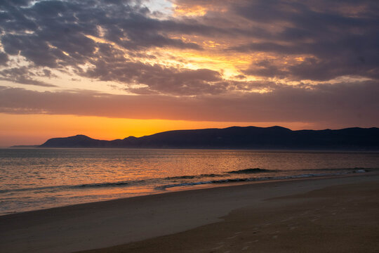 P&ocirc;r do sol na praia